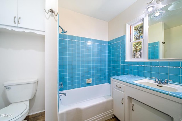 5028 El Adobe Ln, La Crescenta, CA 91214 - bathroom featuring vanity, tile walls, washtub / shower combination, and wood finished floors