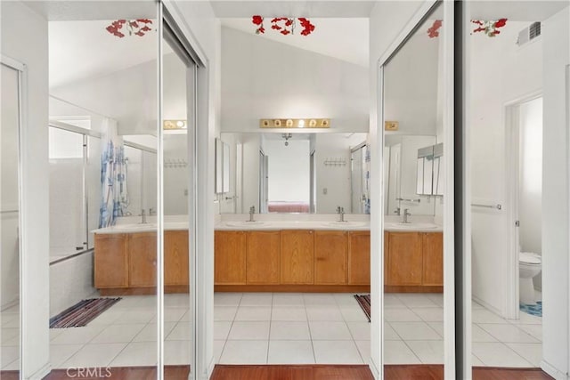 full bathroom with tile patterned flooring, visible vents, a sink, and double vanity