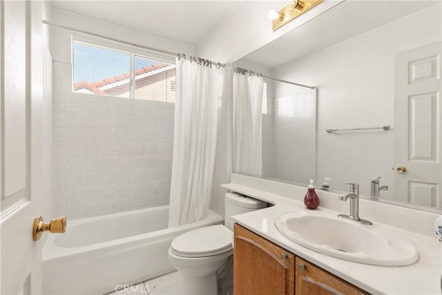 bathroom with shower / bath combo, vanity, and toilet