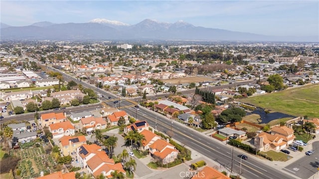 birds eye view of property with a residential view and a mountain view