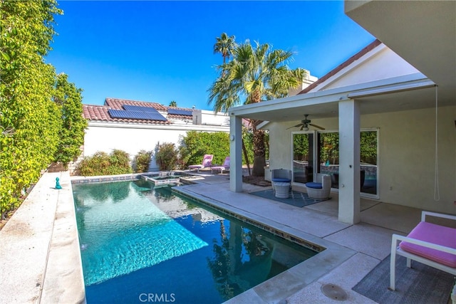 view of pool featuring a patio area, a fenced in pool, and a ceiling fan