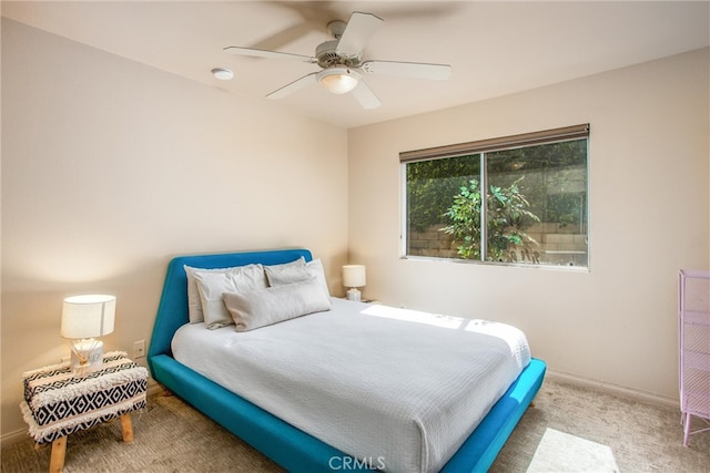 bedroom featuring carpet flooring, a ceiling fan, and baseboards