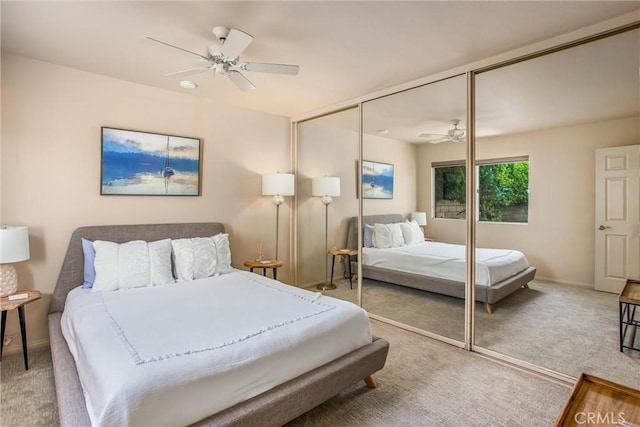 bedroom featuring carpet, a closet, and ceiling fan