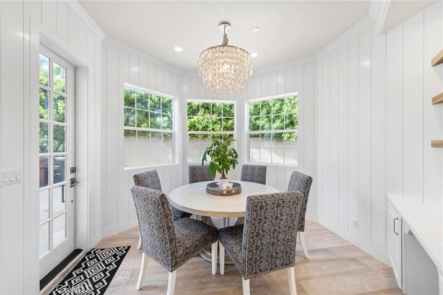 dining room with a chandelier, ornamental molding, recessed lighting, and baseboards