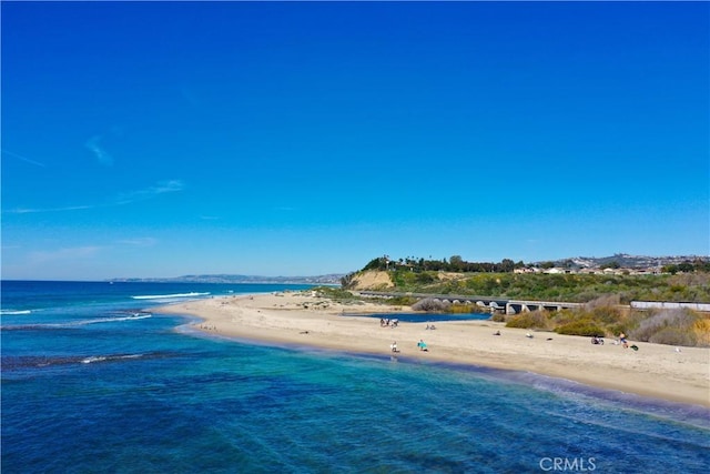 aerial view with a beach view and a water view