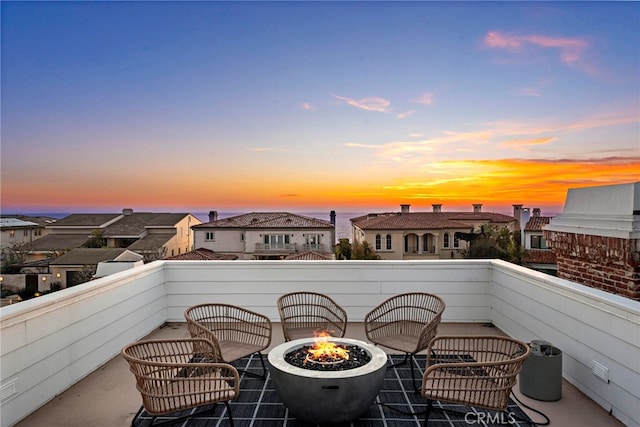 balcony featuring a residential view and a fire pit