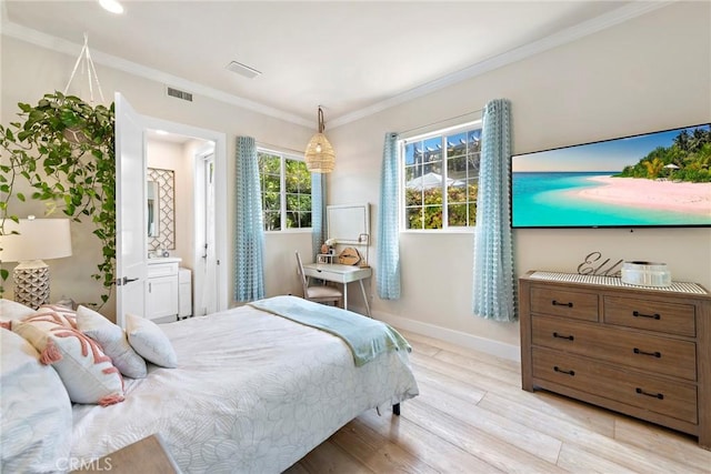 bedroom with baseboards, ornamental molding, visible vents, and light wood-style floors