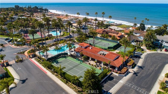 aerial view featuring a water view and a beach view