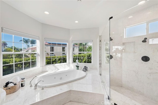 full bathroom featuring a whirlpool tub, a shower stall, and recessed lighting