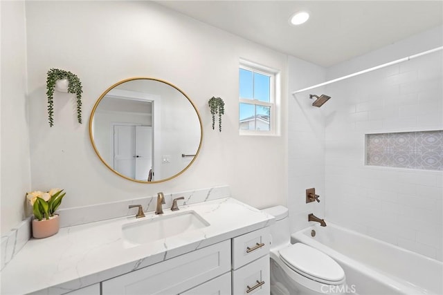 bathroom featuring  shower combination, recessed lighting, vanity, and toilet