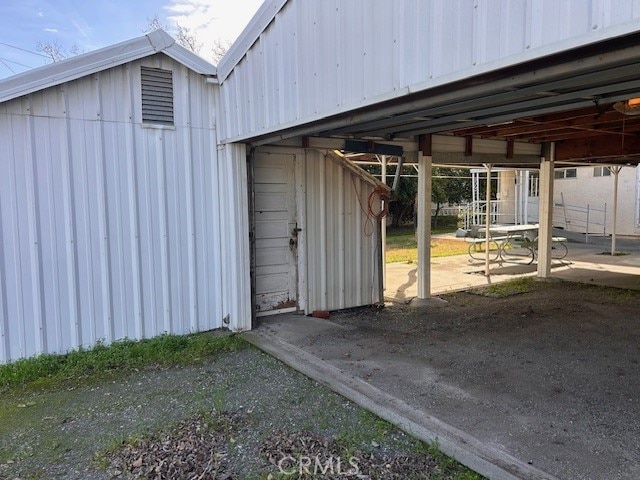 view of outbuilding with an exterior structure