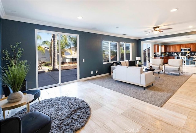 living area featuring recessed lighting, crown molding, baseboards, and ceiling fan