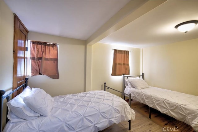 bedroom featuring wood finished floors