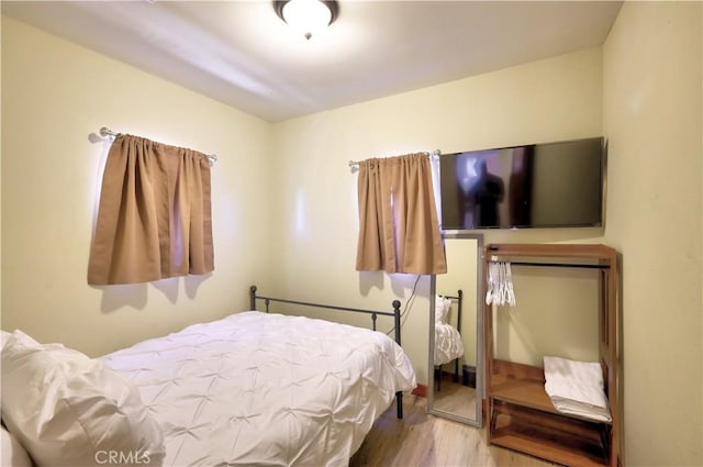 bedroom with wood finished floors