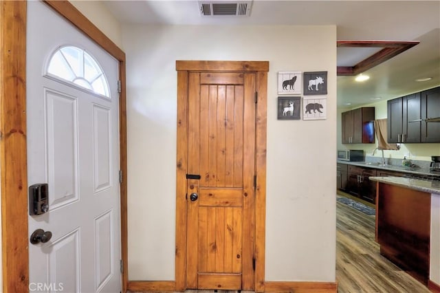 entryway featuring visible vents and wood finished floors