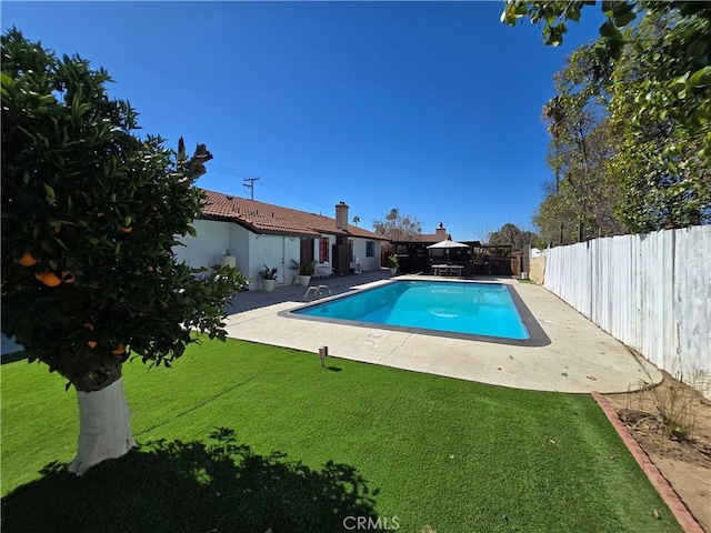 view of pool featuring a fenced in pool, a lawn, a patio, a fenced backyard, and a gazebo