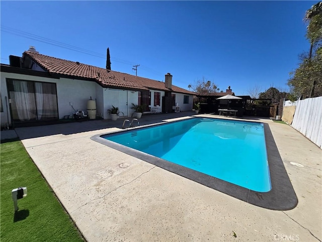 view of pool featuring a patio area, fence private yard, and a fenced in pool