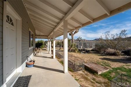 view of patio featuring fence