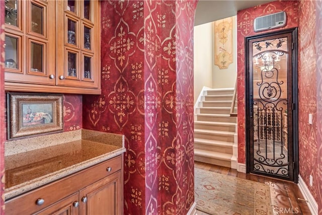 bathroom featuring baseboards, wood finished floors, and vanity