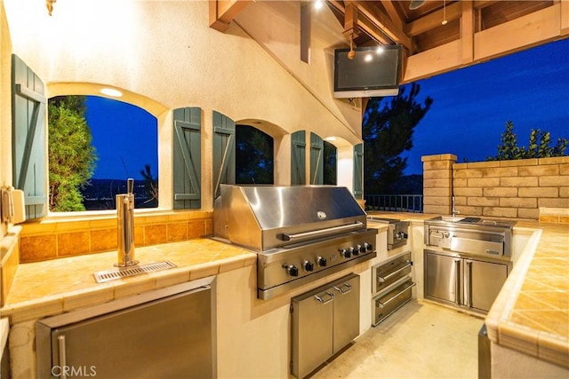 view of patio / terrace featuring exterior kitchen and area for grilling