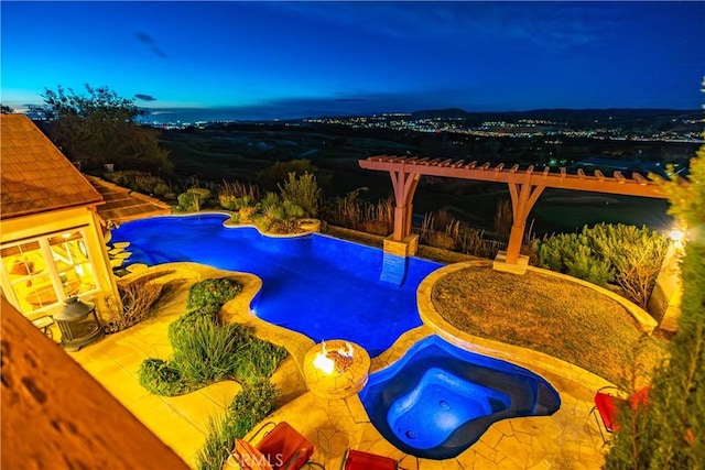 pool at dusk with a patio area, an outdoor pool, and an in ground hot tub