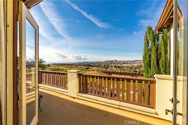 balcony featuring a mountain view