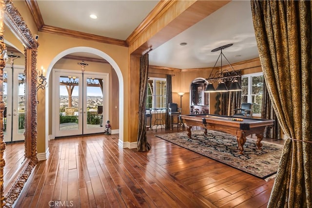 playroom with crown molding, billiards, wood finished floors, and french doors