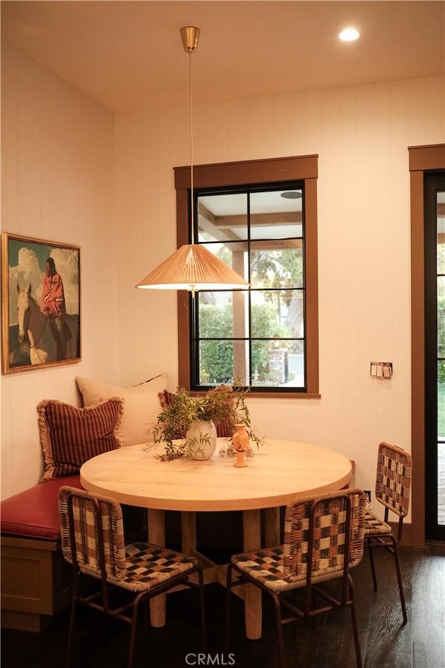 dining area featuring breakfast area and dark wood finished floors