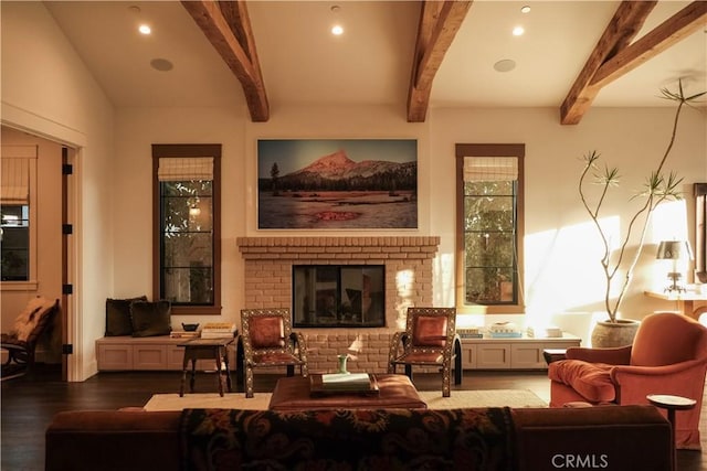 interior space featuring a brick fireplace, recessed lighting, beamed ceiling, and wood finished floors