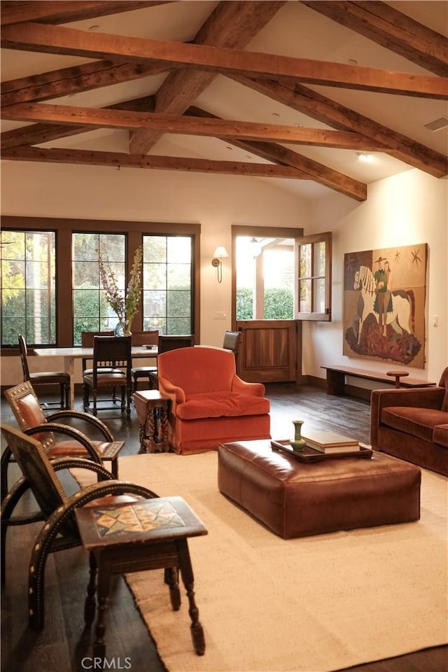 living room featuring visible vents, a healthy amount of sunlight, and lofted ceiling with beams