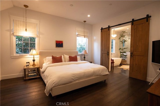 bedroom with dark wood-style floors, recessed lighting, a barn door, vaulted ceiling, and baseboards