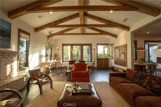 living room featuring visible vents, wood finished floors, vaulted ceiling with beams, a fireplace, and recessed lighting