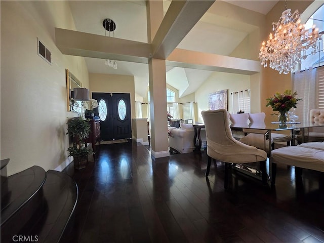 entrance foyer featuring baseboards, dark wood-style flooring, visible vents, and an inviting chandelier