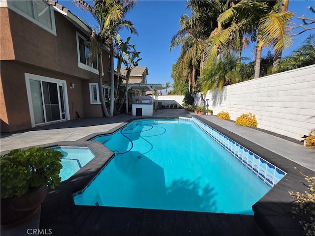 view of swimming pool featuring a patio area, a fenced backyard, a pergola, and a fenced in pool