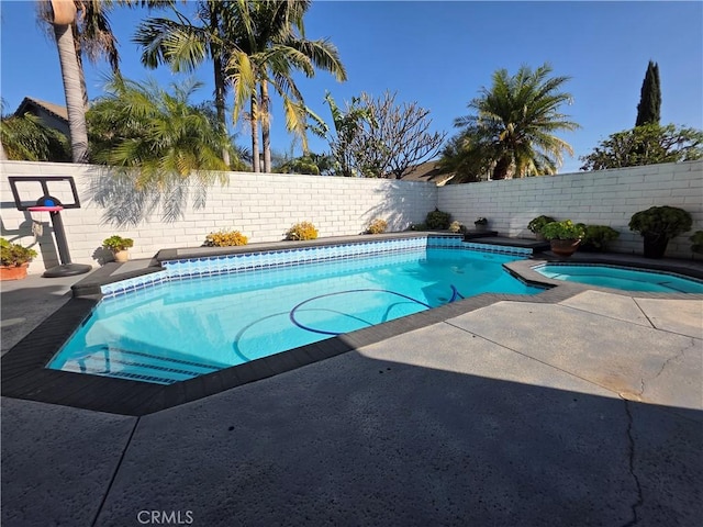 view of swimming pool with a fenced backyard and a fenced in pool