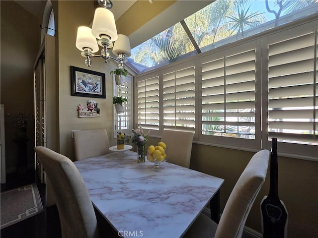 dining area featuring a notable chandelier