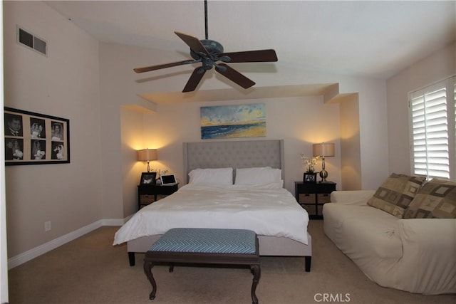 bedroom with light colored carpet, visible vents, lofted ceiling, and baseboards