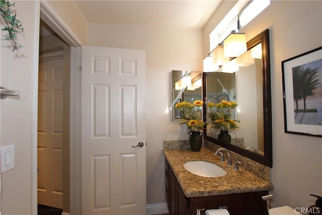 half bath with vanity and toilet