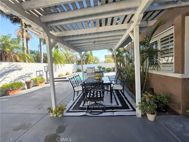 view of patio featuring a fenced backyard, outdoor dining area, and a pergola