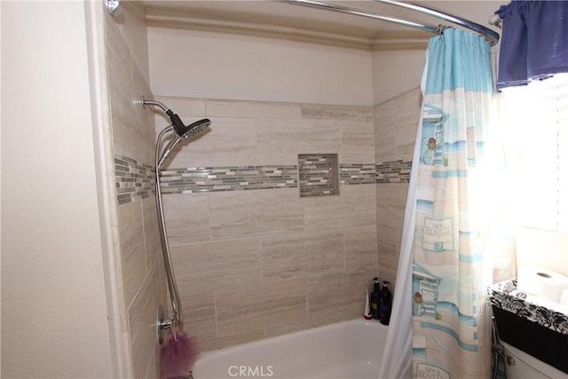 bathroom featuring shower / bathtub combination with curtain and vanity