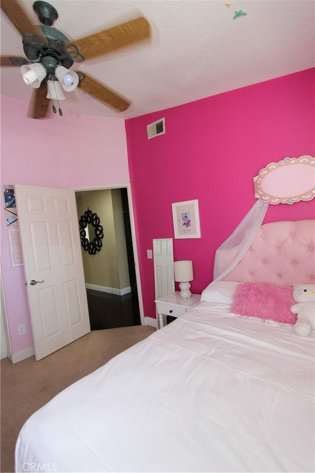 carpeted bedroom with visible vents and a ceiling fan