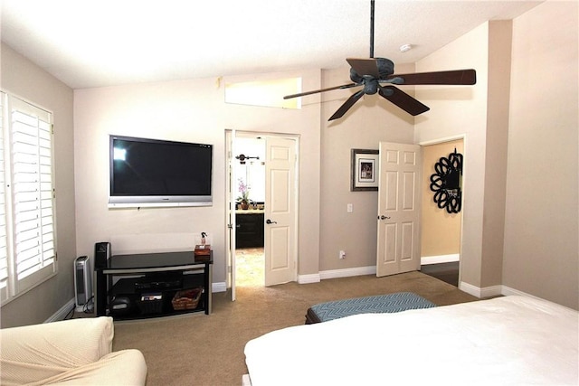 bedroom with a ceiling fan, carpet flooring, vaulted ceiling, and baseboards