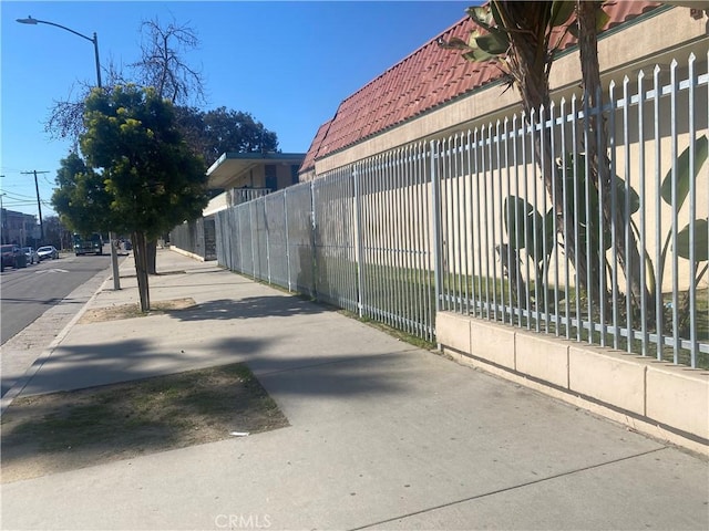 view of gate featuring fence