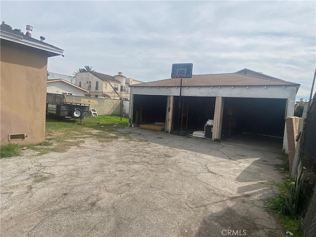 garage with fence