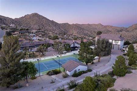 birds eye view of property featuring a mountain view