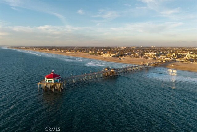 aerial view featuring a water view and a view of the beach