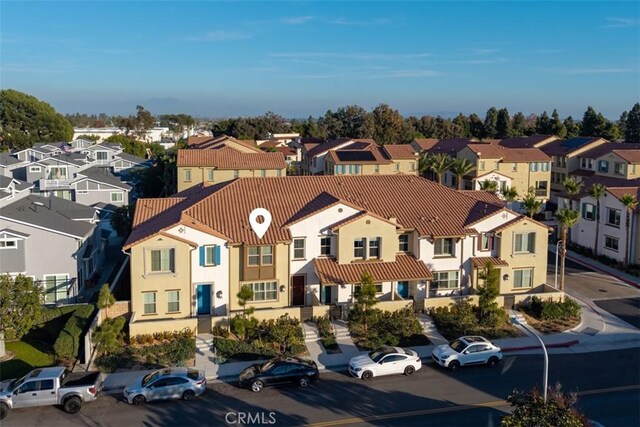 birds eye view of property with a residential view