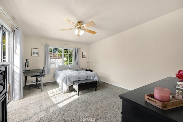 bedroom with carpet floors, ceiling fan, and baseboards