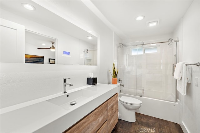 bathroom featuring ceiling fan, toilet, recessed lighting, combined bath / shower with glass door, and vanity