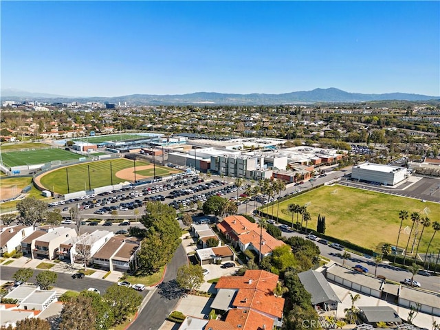 birds eye view of property featuring a mountain view